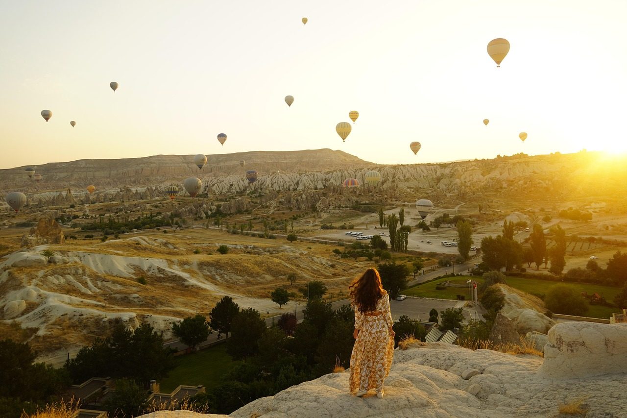 hot air balloons, valley, girl, woman, tourist, nature, traveler, leisure, adventure, mountains, mountain range, scenery, scenic, sunrise, cappadocia, turkey