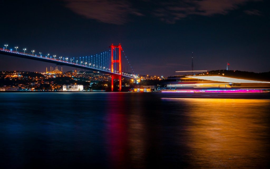 A long exposure photo of a bridge at night