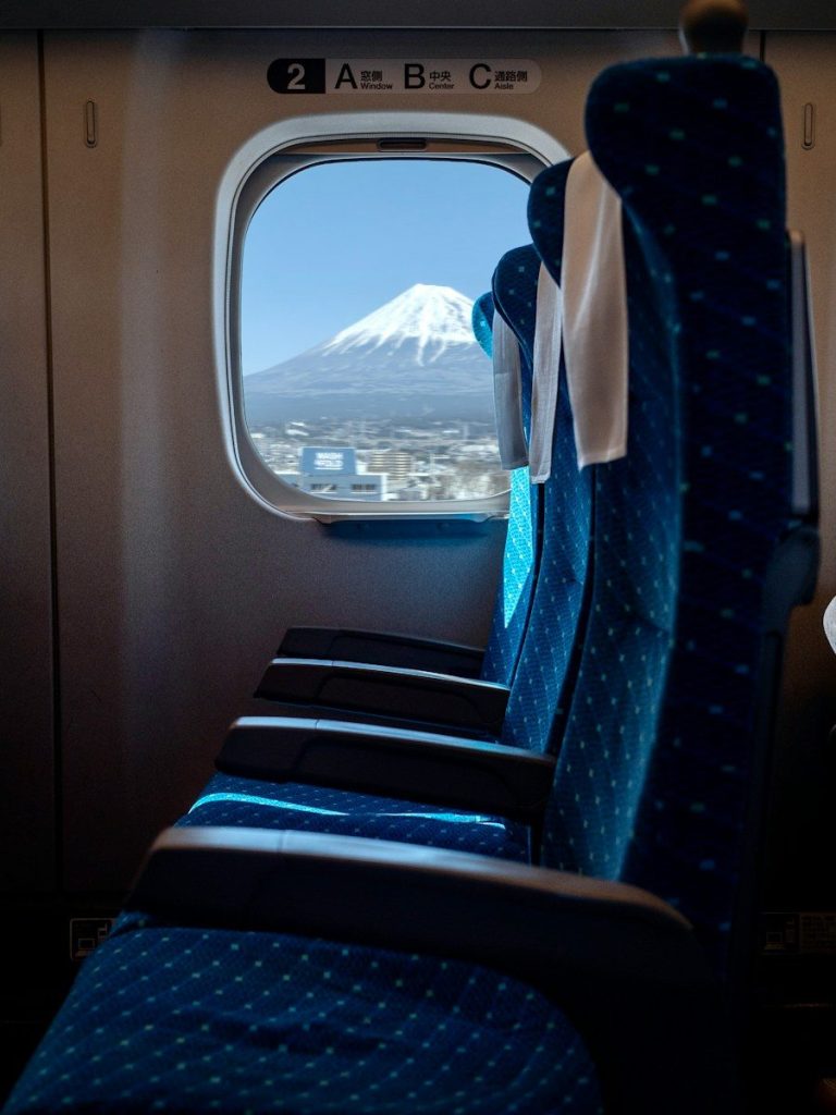 Rows of seats inside a Shinkansen bullet-train carriage