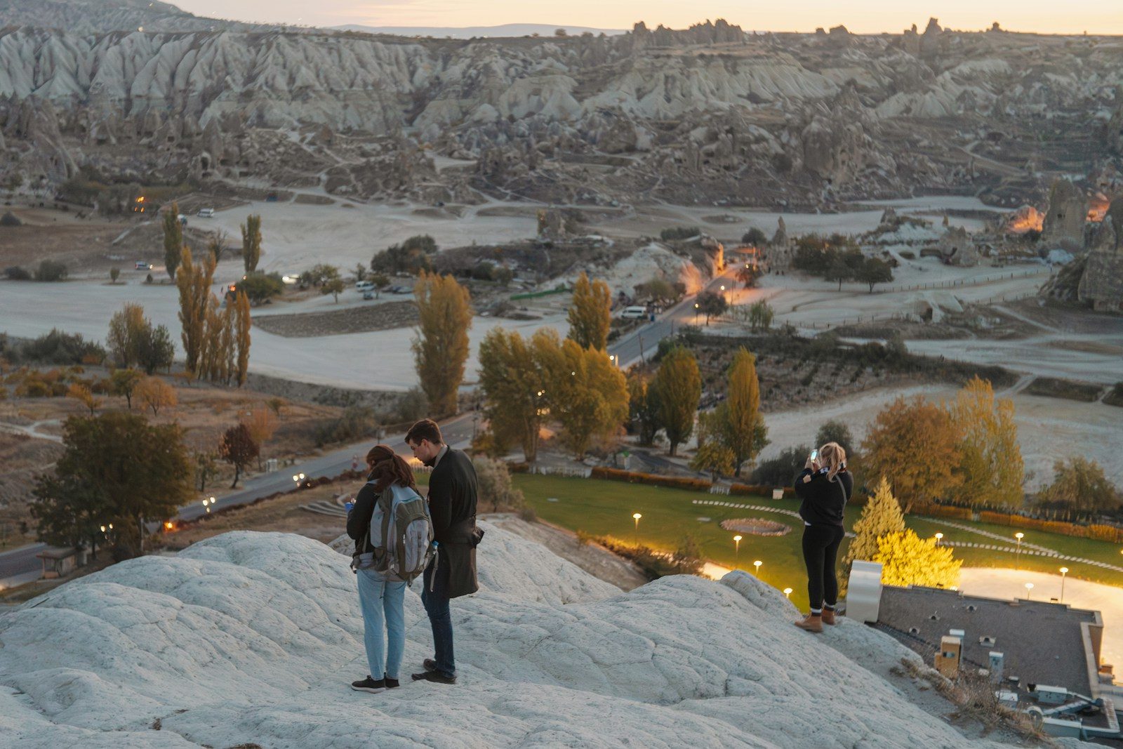 A group of people standing on top of a snow covered hill